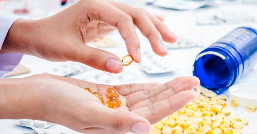 Fish oil capsules in palm
