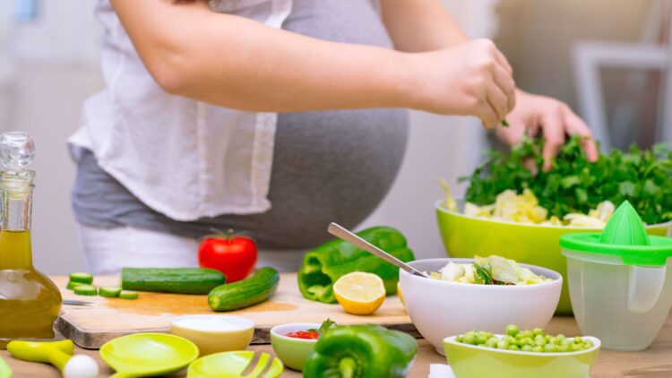 Pregnant woman cooking